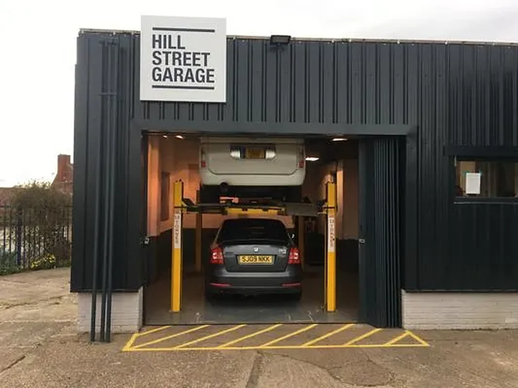 The front of Hill Street Garage on Hill Street, Worksop, with a car up on the two-post ramp